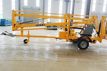 Буксируемый стреловой подъемник – гибридный дизель-электрический для эффективной и универсальной работы