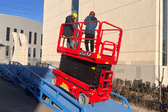 Self propelled scissor lift and yard ramps